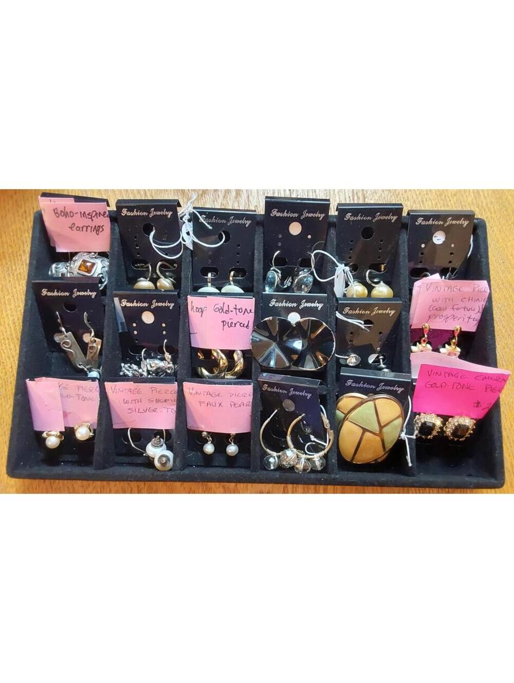 Various vintage and modern fashion pierced earrings.
